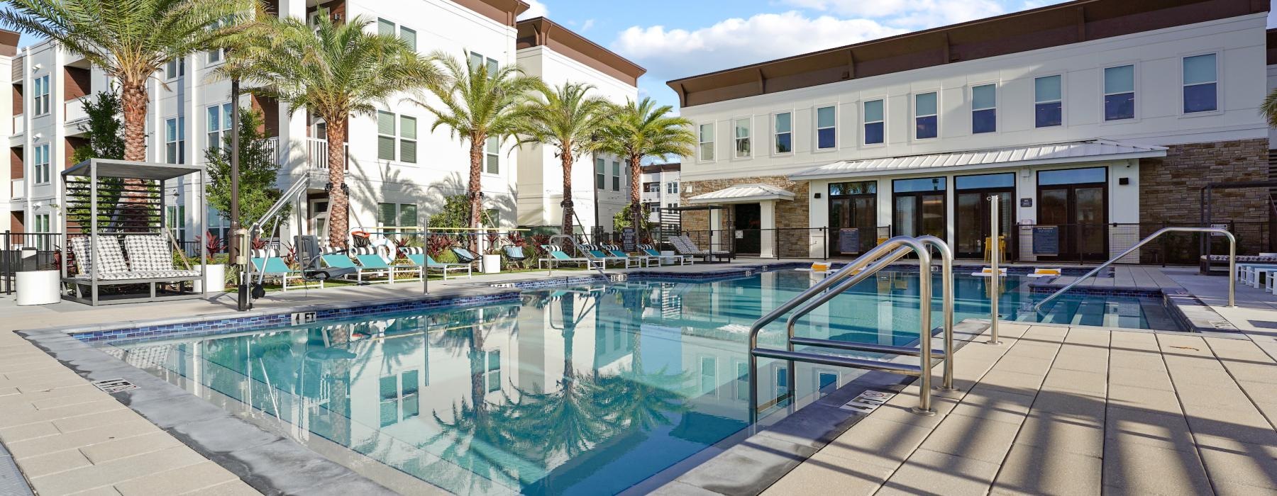 a swimming pool in front of a building