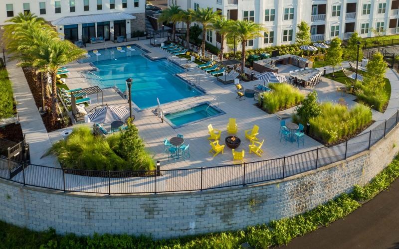 a pool with a building in the background