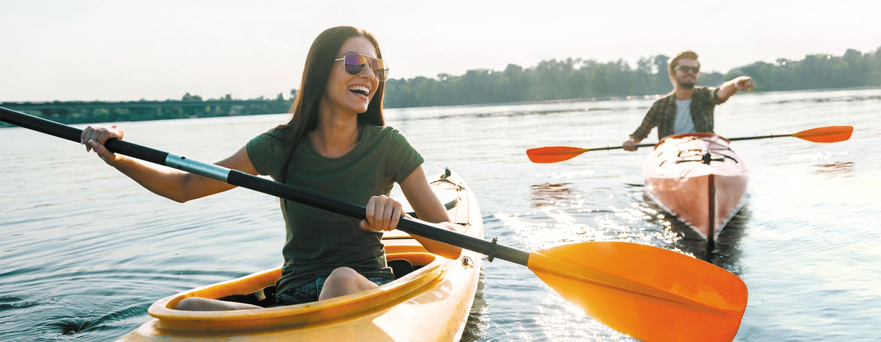 couple on river kayaking