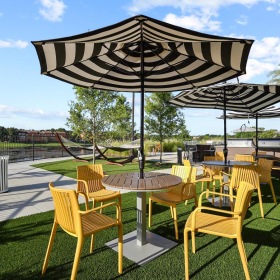 The essence of exceptional living a table and chairs outside