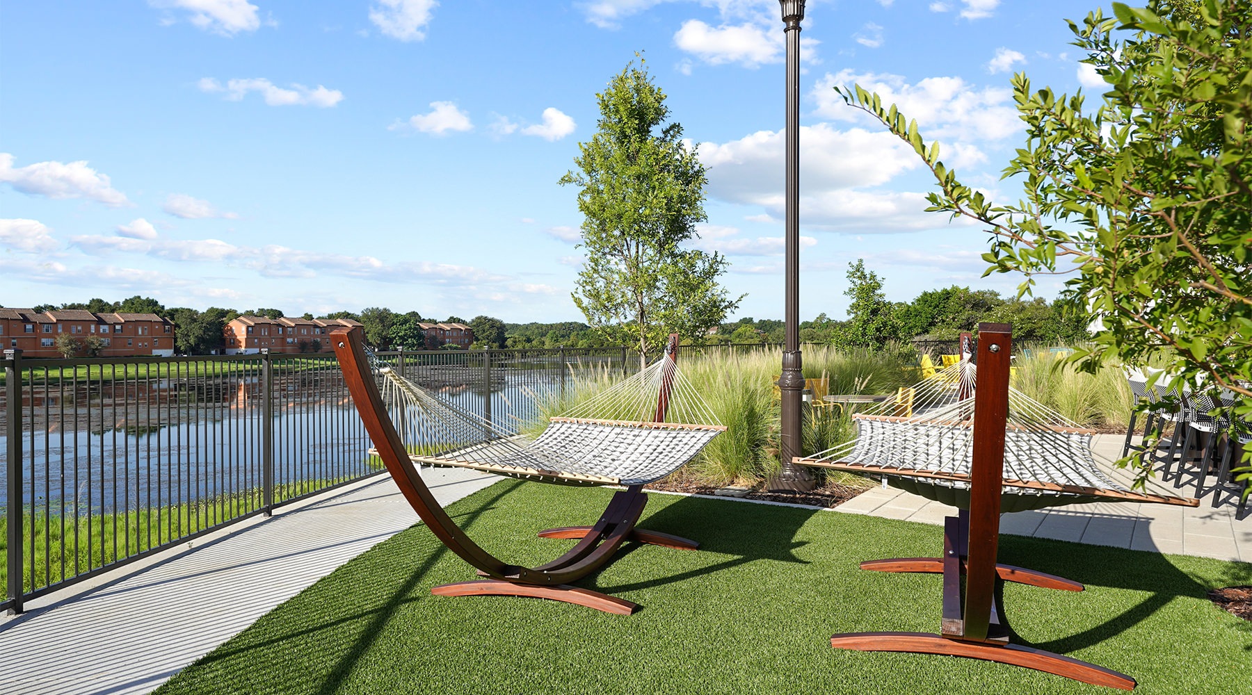 Find your perfect fit at Millennium MetroWest a playground with a body of water in the background